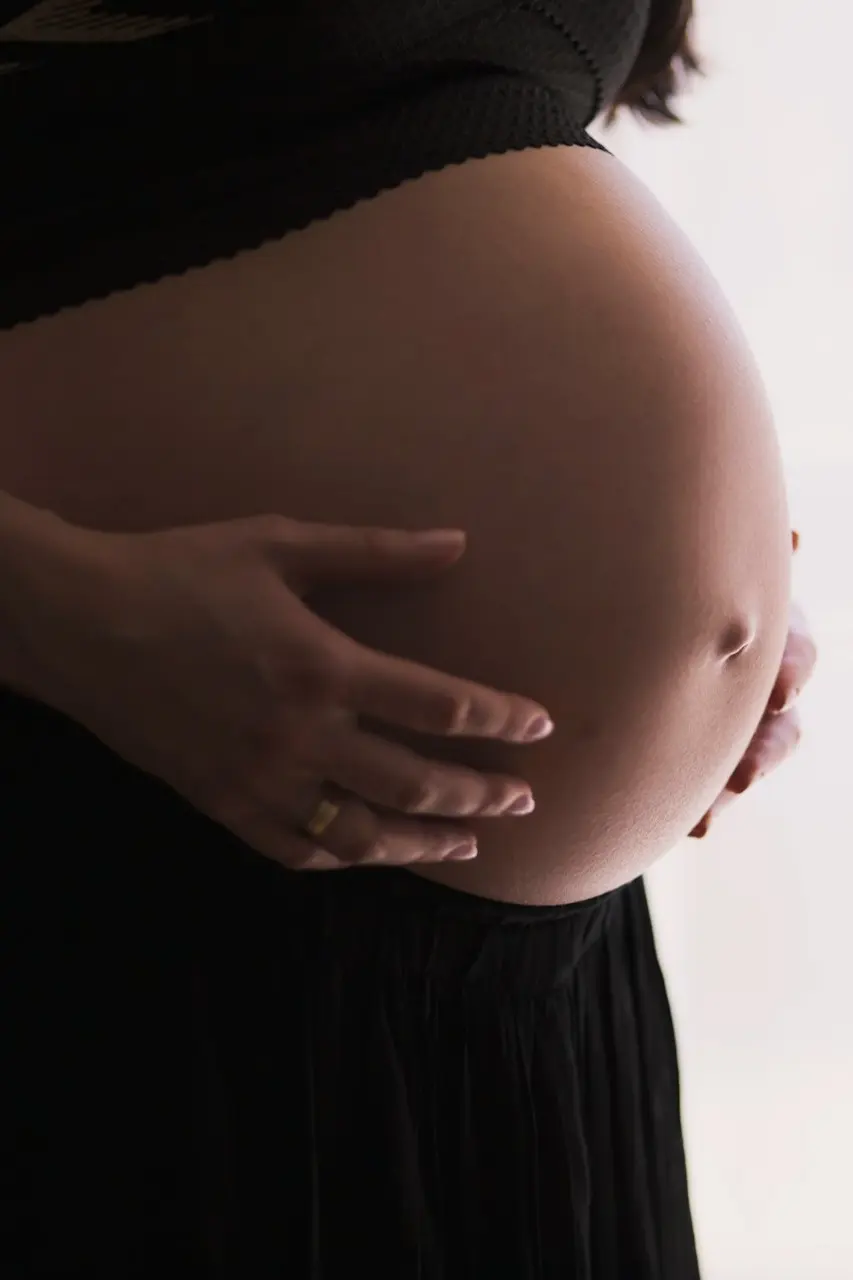 woman holding stomach